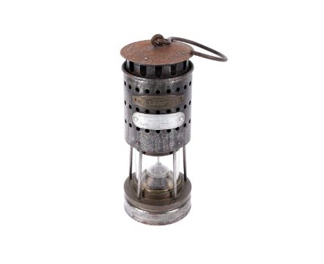 A mine deputies ‘Protector’ lamp, by Hailwood &amp; Ackroyd Ltd, Morley, Yorkshire, the W.B. Lamp No. 2, 26cms high.