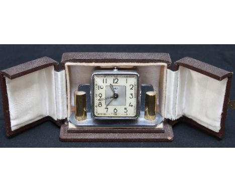 A 1930s Art Deco style DEP Savoy chrome plated travelling alarm clock, in a fitted leather case.
