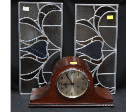 A pair of leaded coloured glass window lights, and a 1930s oak cased mantle clock (3).