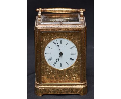 A 19th century repeating carriage clock by Charles Frodsham, finely engraved all over with scrolls and flowers, with circular