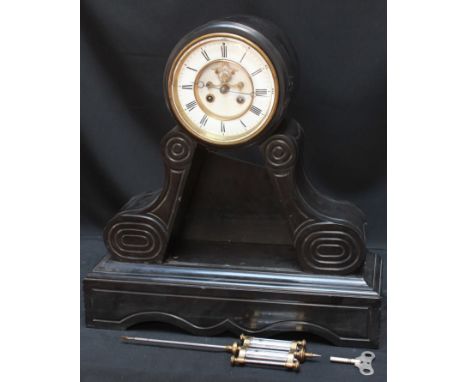 A black slate mantel clock with 8 day movement striking a bell and mercury, compensation pendulum. For restoration.