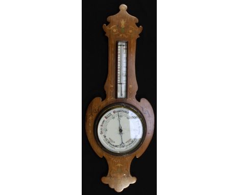 An Edwardian mahogany inlaid aneroid banjo barometer by T. Woolley of Chester, inlaid with flowers and harebells, with white 