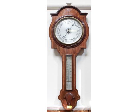 An Edwardian aneroid barometer and thermometer in inlaid mahogany case.