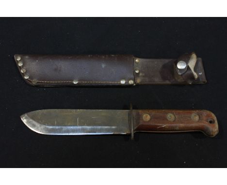 A British Wilkinson type D. MOD survival knife and scabbard.