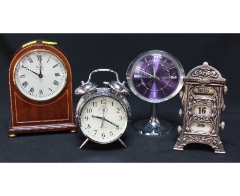 A small modern mahogany mantle clock, two alarm clocks and a silver plated desktop calendar.
