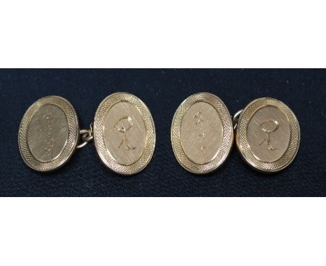 A pair of 18ct gold oval cufflinks, with engine turned borders and engraved initials. Approx 15 grams.