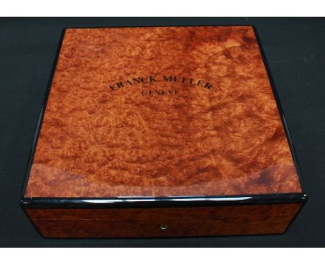 A Franck Muller of Genève burr wood effect watch box, hinge AF.