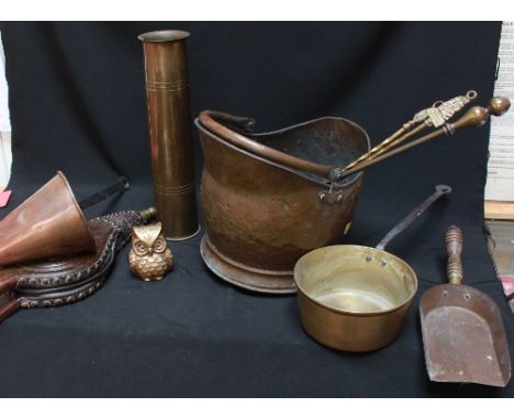 A copper coal helmet, pair of bellows, fire irons and other brass and copper items