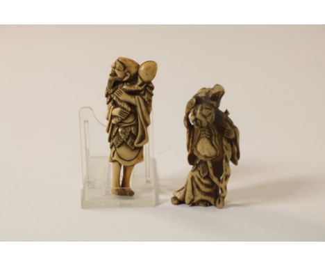 1x carved bone and 1x ivory netsuke of two male figures one with  a frog on his shoulder, Japan Meiji-period (1868-1913), l. 