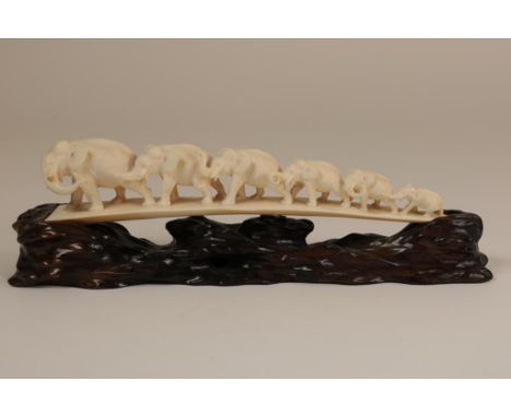 Carved ivory sculpture of a elephant bridge with 6 elephants  on wooden base, Japan ca. 1900-1912, h. 9.5, w. 28, d. 7  cm.  