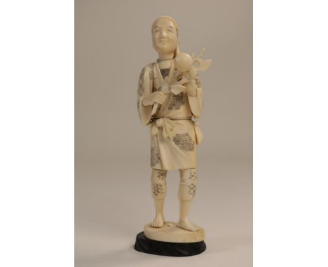 Carved ivory Okimono sculpture of a lumberjack with his knapsack  and a peach branch, Japan ca. 1900-1920, h. 18 cm.  The ite