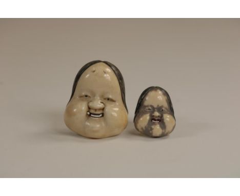 a pair of carved ivory Noh masks Netsuke of the female deity  Okame or Otafuka, signed,  Japan ca. 1900, h. 6 and h. 3.5 cm. 