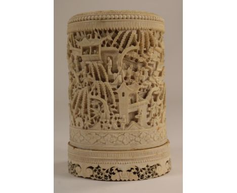 Carved ivory brush pot decorated with figures in a garden,  China, Canton ca. 1800-1850, h. 17, diam. 11 cm. (base broken en 