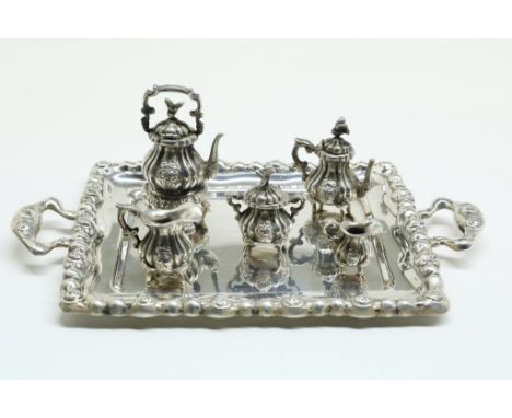Silver miniature tray with five piece coffee and tea service,  with rose pattern, Dutch retailer's mark D. Aubert, 835/000,  
