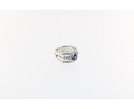 White gold ring with harp motives, set with an oval,  facetted sapphire, ca. 0.65 ct and brilliant cut diamonds, total  ca. 0