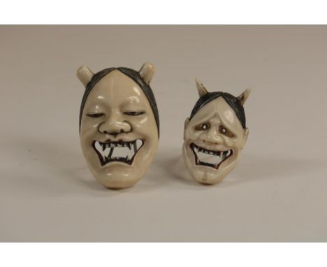 a pair of carved ivory Noh masks Netsuke of the female Hannya,  1x signed, Japan ca. 1900, h. 5.5. and h. 3.5 cm.    The item