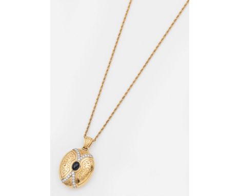 Saphir-Diamantanhänger mit KetteGelbgold, gest. 18 k. Zentral besetzt mit einem ovalen, tintenblauen Saphircabochon, entourie