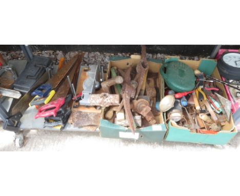 SHELF OF TOOLS INCLUDING PICK AXE HEADS + OTHER TOOL HEADS, SAWS ETC