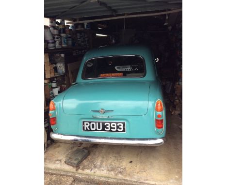 A 1957 Ford Prefect 100E, powder blue, four-door, three previous owners, same owner since 1973, recorded mileage 38,558, car 