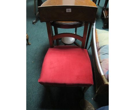 A PAIR OF GEORGIAN MAHOGANY PANEL BACK DINING CHAIRS on square tapering legs