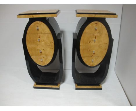 A PAIR OF ART DECO STYLE WALNUT AND EBONISED PEDESTALS each with a rectangular moulded top containing four frieze drawers rai