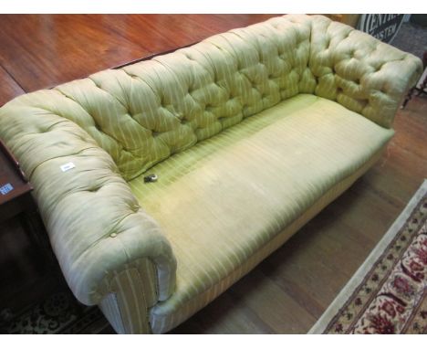 A LATE VICTORIAN MAHOGANY BUTTON BACK COUCH with gold stripped upholstery 198cm wide