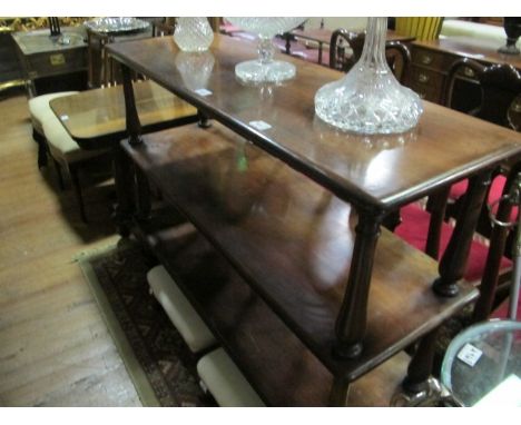 A VICTORIAN MAHOGANY THREE TIER DUMB WAITER each rectangular moulded shelf joined by a baluster support on conforming legs 10