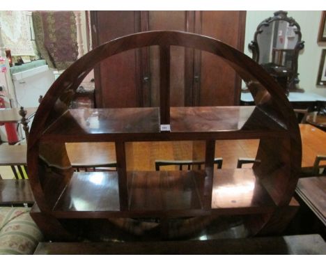 AN ART DECO STYLE ROSEWOOD CIRCULAR DISPLAY CABINET with shaped divisions and outswept feet 161cm (h) x 131cm (w) x 39cm (d)