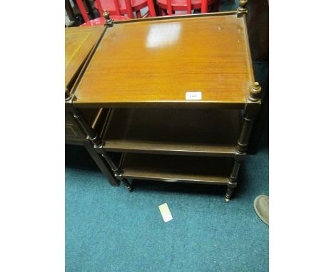 A MAHOGANY THREE TIER OCCASIONAL TABLE of rectangular form with moulded gallery joined by ring turned supports 66cm (h) x 50c