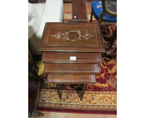 A NEST OF FOUR ROSEWOOD AND MOTHER OF PEARL INLAID TABLES each of rectangular form with moulded gallery and inlaid panel rais