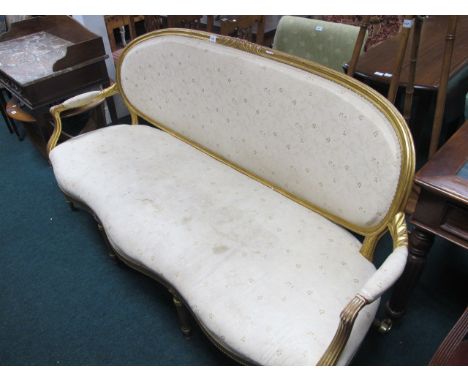 A CONTINENTAL GILTWOOD AND UPHOLSTERED SETTEE late 19th Century the moulded top rail above an upholstered back and seat with 