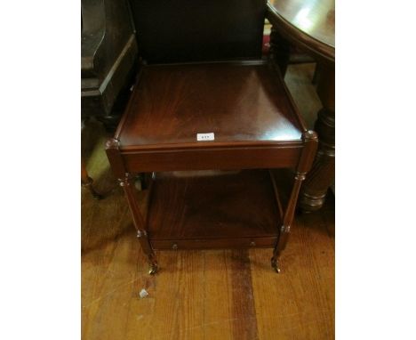 A MAHOGANY TWO TIER OCCASIONAL TABLE of square form the shaped top with moulded gallery above an open shelf with frieze drawe