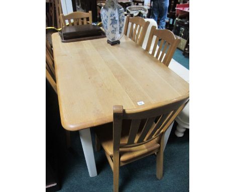 AN OAK DINING ROOM SUITE comprising a rectangular table together with six stick back dining chairs, the table 179cm x 89cm