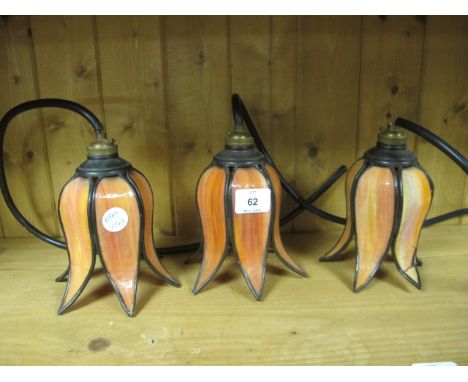 THREE ART DECO STYLE TULIP HANGING LIGHTS with amber shades 