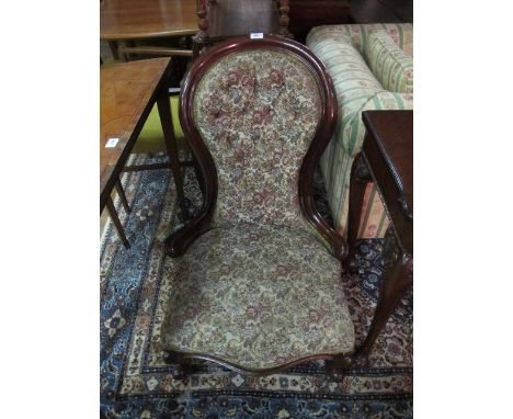 A VICTORIAN MAHOGANY LADIES CHAIR the curved top rail above a button upholstered back and seat on cabriole legs