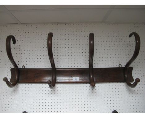 A BENTWOOD HAT AND COAT STAND with four hooks 81cm wide