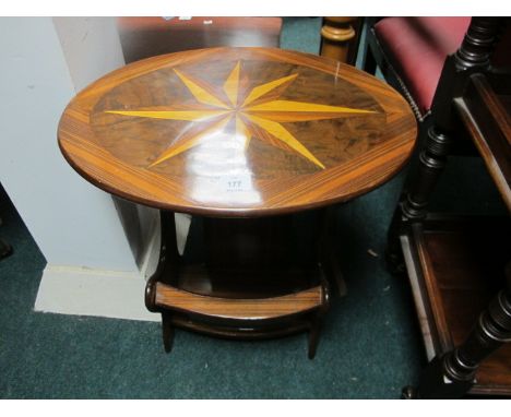 A WALNUT AND MARQUETRY MAGAZINE TABLE the oval table with inlaid panel above an open compartment on splayed legs 62cm (h) x 5