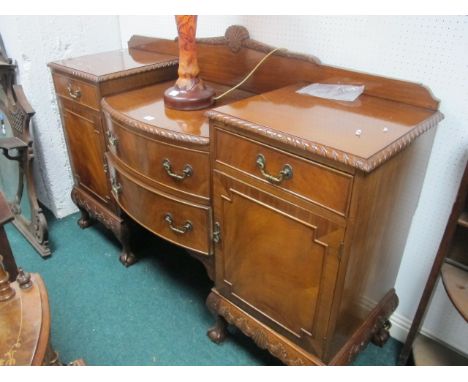 AN EIGHT PIECE CHIPPENDALE STYLE MAHOGANY DINING SUITE comprising six chairs each with a pierced vertical splat above an upho