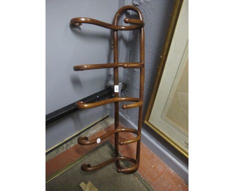 A BENTWOOD HAT AND COAT STAND with scrolls 99cm wide