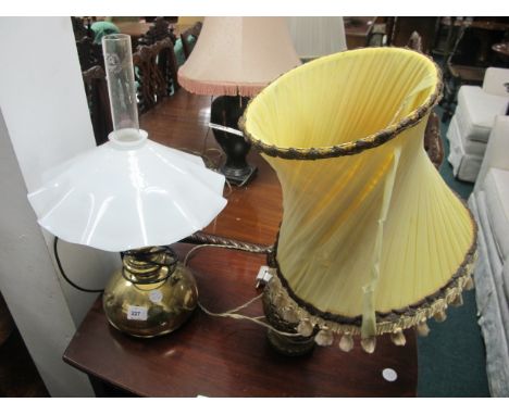 A BRASS TABLE LAMP with shaped glass shade together with one other