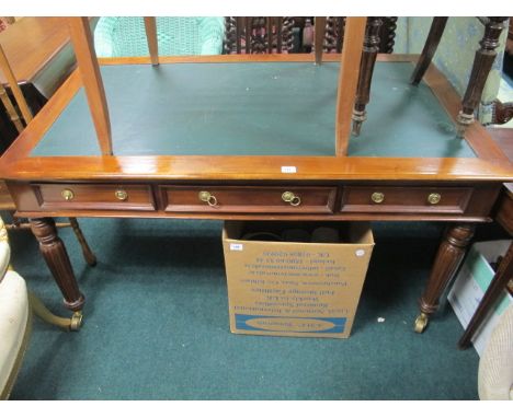 A REGENCY STYLE MAHOGANY LIBRARY TABLE the rectangular top with leather inset above three frieze drawers with opposing drawer