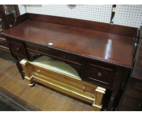 A REGENCY MAHOGANY SIDEBOARD the rectangular top with moulded gallery above a frieze drawer and cupboards on spiral twist and