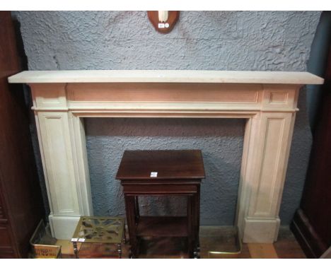 A COMPOSITION SANDSTONE FIREPLACE the rectangular shelf above a panel frieze on conforming jabs 127cm (h) x 190cm (w) x 25cm 