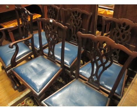 A SET OF SIX CHIPPENDALE STYLE MAHOGANY DINING CHAIRS c.1900 including an elbow chair each with a serpentine top rail above a
