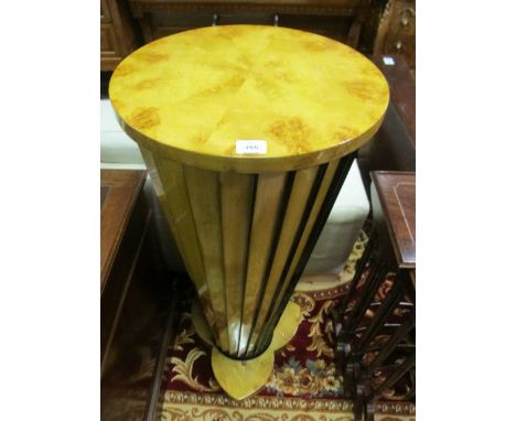 A PAIR OF ART DECO STYLE WALNUT PEDESTALS each of circular form the shaped top above a slatted tapering column on shaped plat