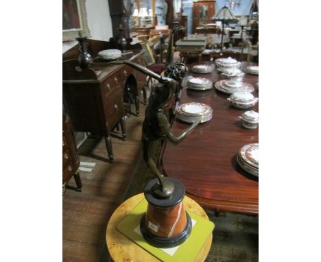 AN ART DECO STYLE BRONZE FIGURE modelled as a female shown standing on one leg raised on a rouge marble base