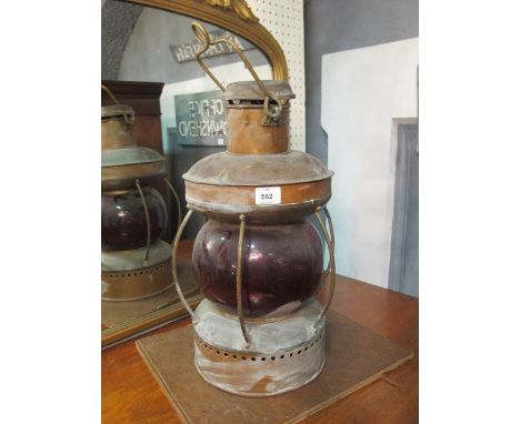 A GOOD VICTORIAN COPPER SHIPS LAMP with red glass shade