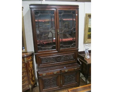 AN EDWARDIAN MAHOGANY SECRETAIRE BOOKCASE with thirteen pane astragal glazed doors and carved panel doors below 144cm (h) x 1