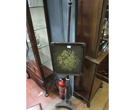 A REGENCY ROSEWOOD POLE SCREEN with tapestry panel and triangular base 162cm (h) x 40cm (w)