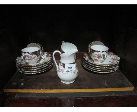 A PART ENGLISH PORCELAIN TEA SERVICE together with a part Royal Sutherland bone China tea service (2)
